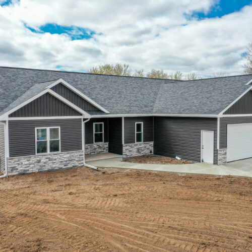 Image of a new home, highlighting its modern design and fresh exterior.