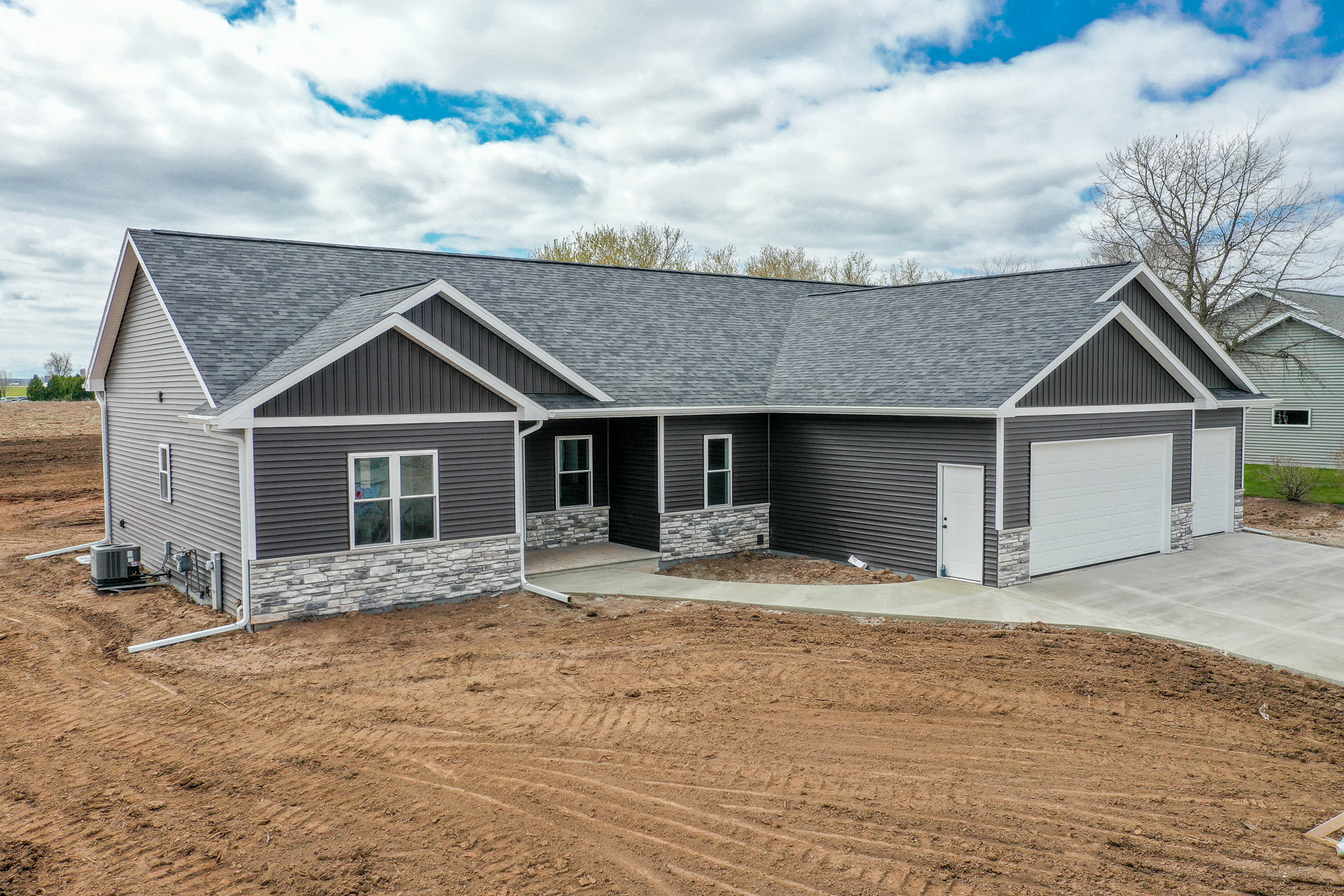Image of a new home, highlighting its modern design and fresh exterior.