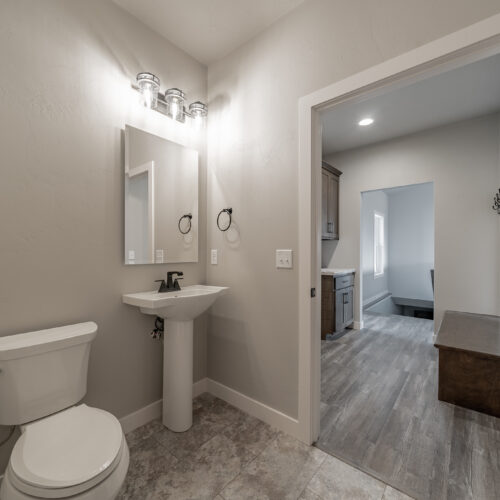 An image of the sink and toliet in the master bathroom of a newly constructed home.