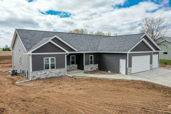 Image of a new home, highlighting its modern design and fresh exterior.