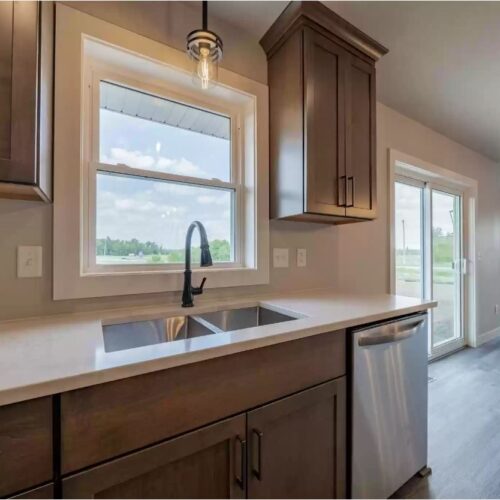 Close-up photo of the kitchen sink in the Milestone floor plan, highlighting its modern design, high-quality fixtures, and sleek finish, reflecting the kitchen's overall contemporary and functional style.