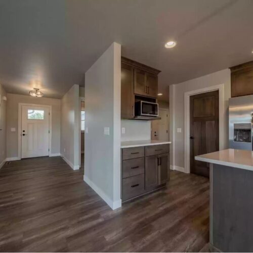 Image of the main entrance in the Milestone floor plan, showcasing its inviting design, modern door, and the overall aesthetic appeal, creating a welcoming first impression of the home.