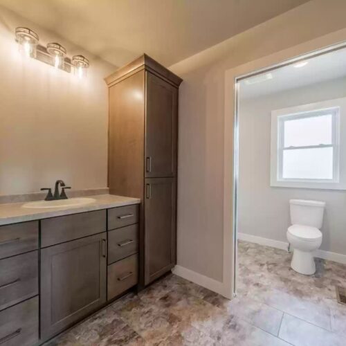 Image of the master bathroom in the Milestone floor plan, showcasing its spacious layout and modern fixtures.