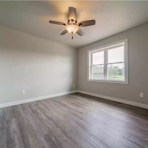 Image of the third bedroom in the Milestone floor plan, highlighting its comfortable layout, modern decor, and inviting atmosphere, suitable for relaxation or use as an additional guest room.