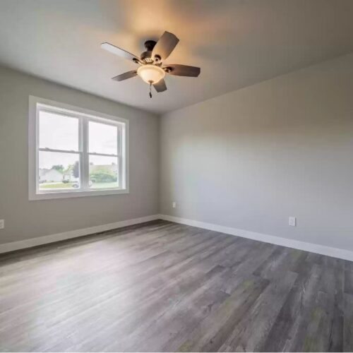 Image showing a different angle of the second bedroom in the Milestone floor plan, emphasizing new aspects of its cozy layout and modern design, and offering a more comprehensive view of the room's inviting ambiance.