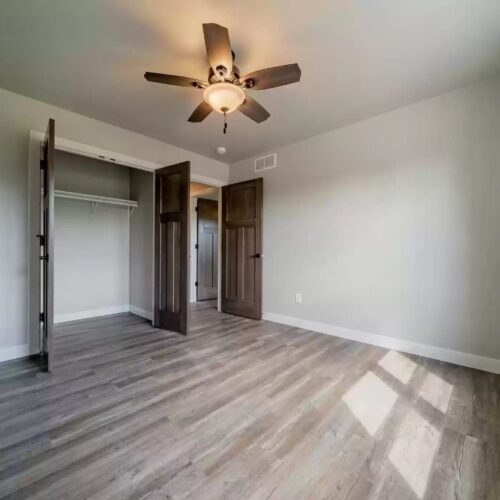 Image of the second bedroom in the Milestone floor plan, showcasing its cozy layout, modern design touches, and the overall inviting ambiance, suitable for relaxation or as a guest room.