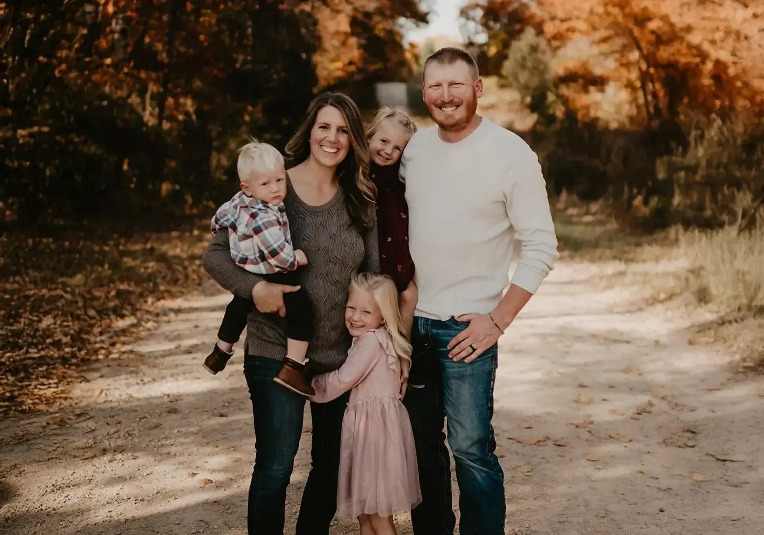 A photograph of Mike Ebben with his wife and three children.
